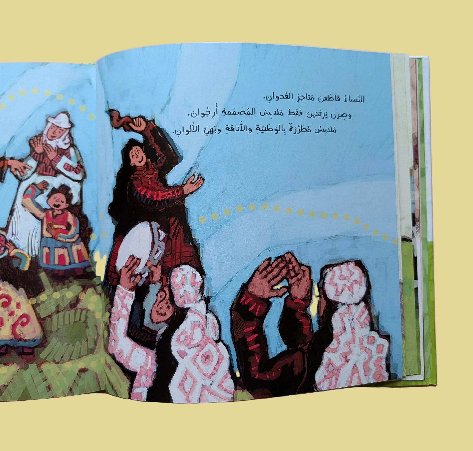 Open book with colorful illustrations on a pink background