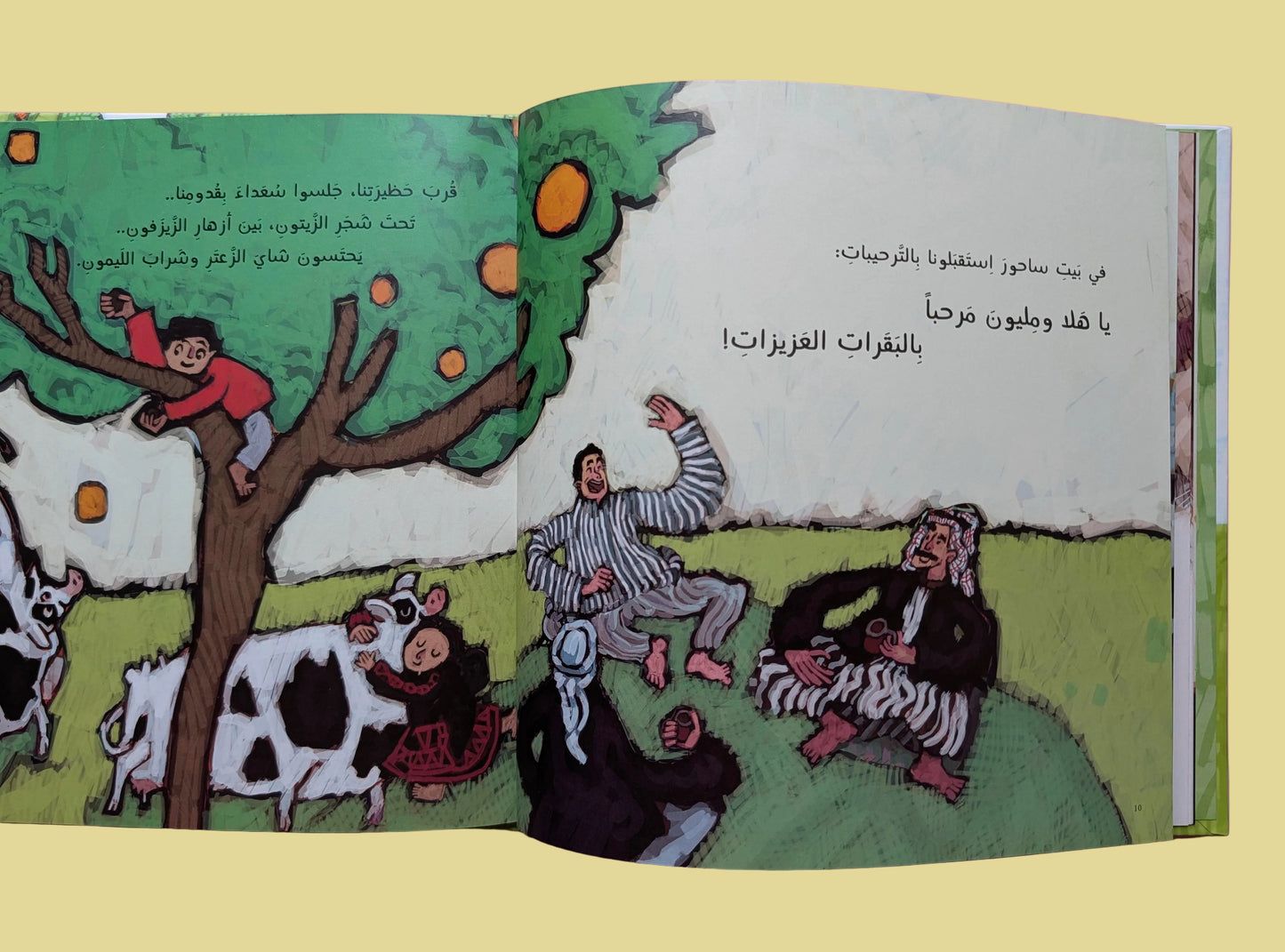 Open book with illustrations of children and animals on a pink background
