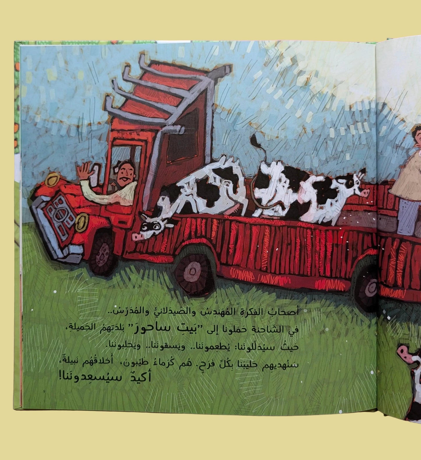 Illustration of a red truck with cows on a page from a book, against a pink background.